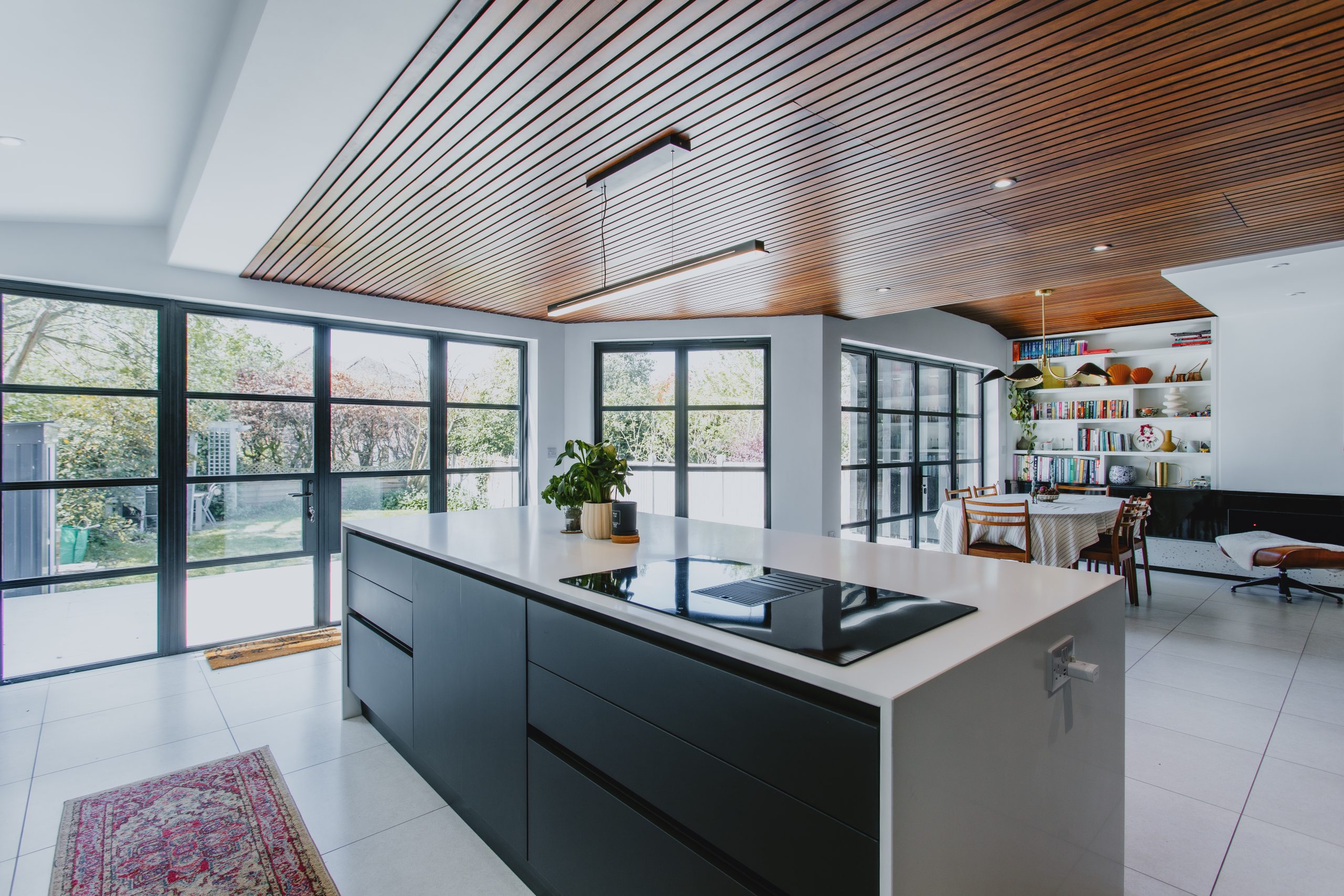 Open-plan kitchen in a West Bridgford extension with black Aluco steel-look screens